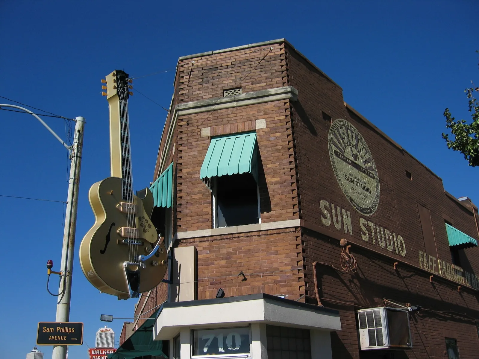 Sun Studio’s brick Memphis corner facade with its hanging guitar sign.