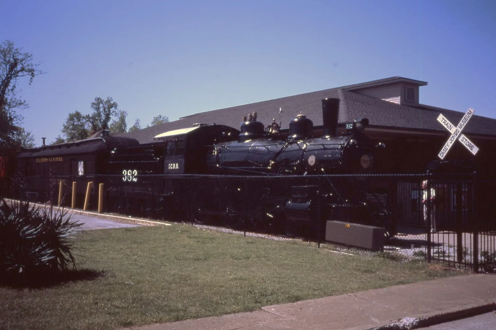 A dark steam locomotive marked 382 outside the Casey Jones Railroad Museum.